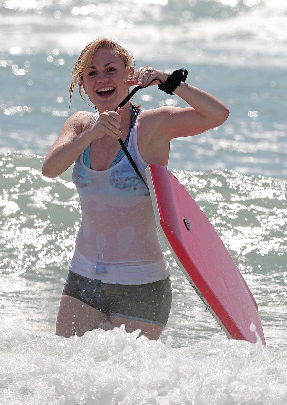 Anna Paquin. hits the beach for some boogie boarding. 