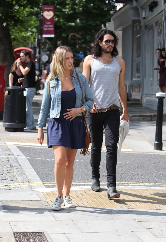 Russell Brand and Laura Gallacher look cosy on family trip with Mabel