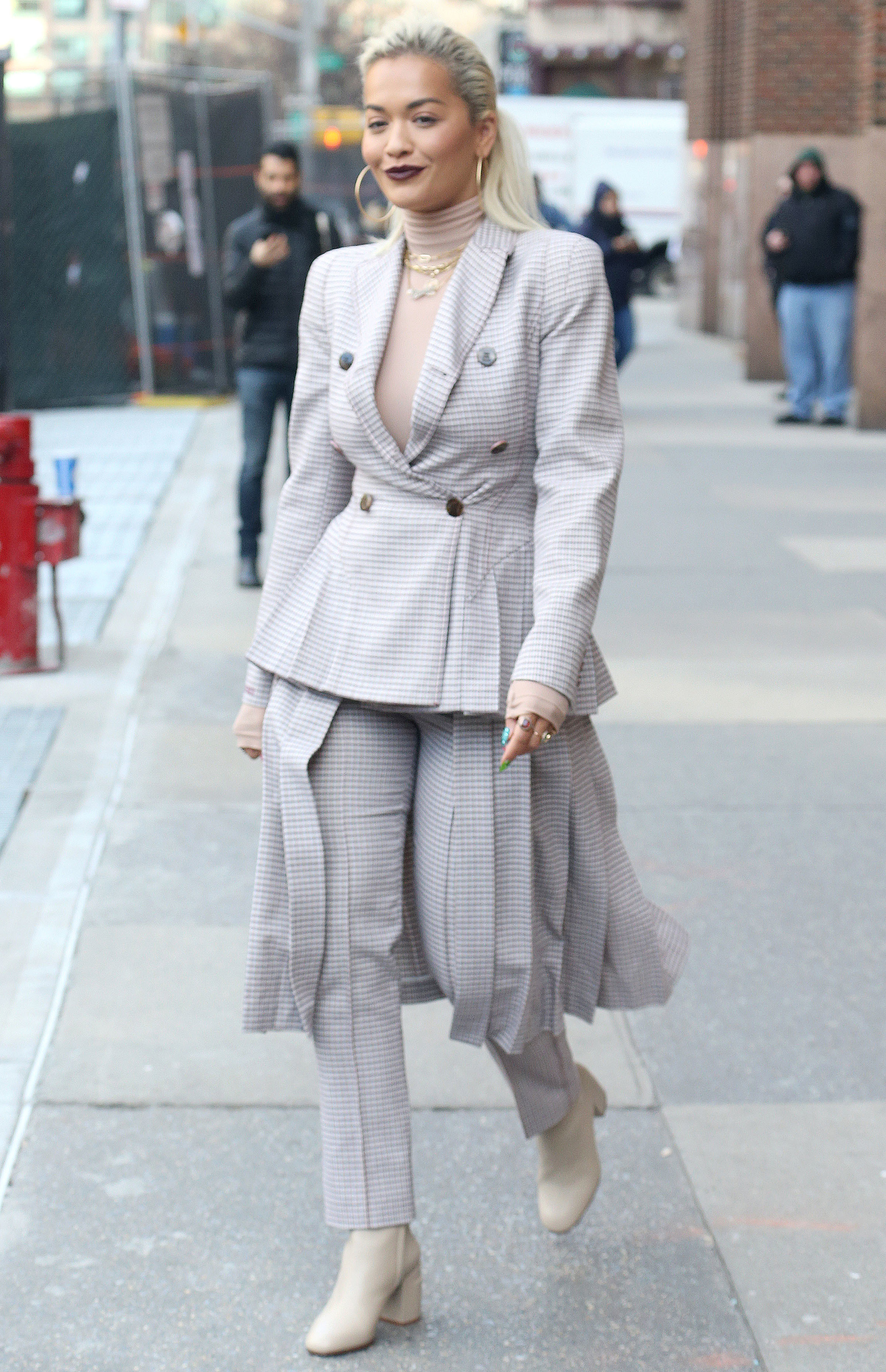 Emma Stone, 29, looks classy in Louis Vuitton low-cut white blazer and  stark black trousers