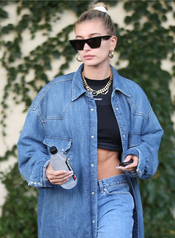 hailey bieber looks casual chic in silk outfit paired with a louis