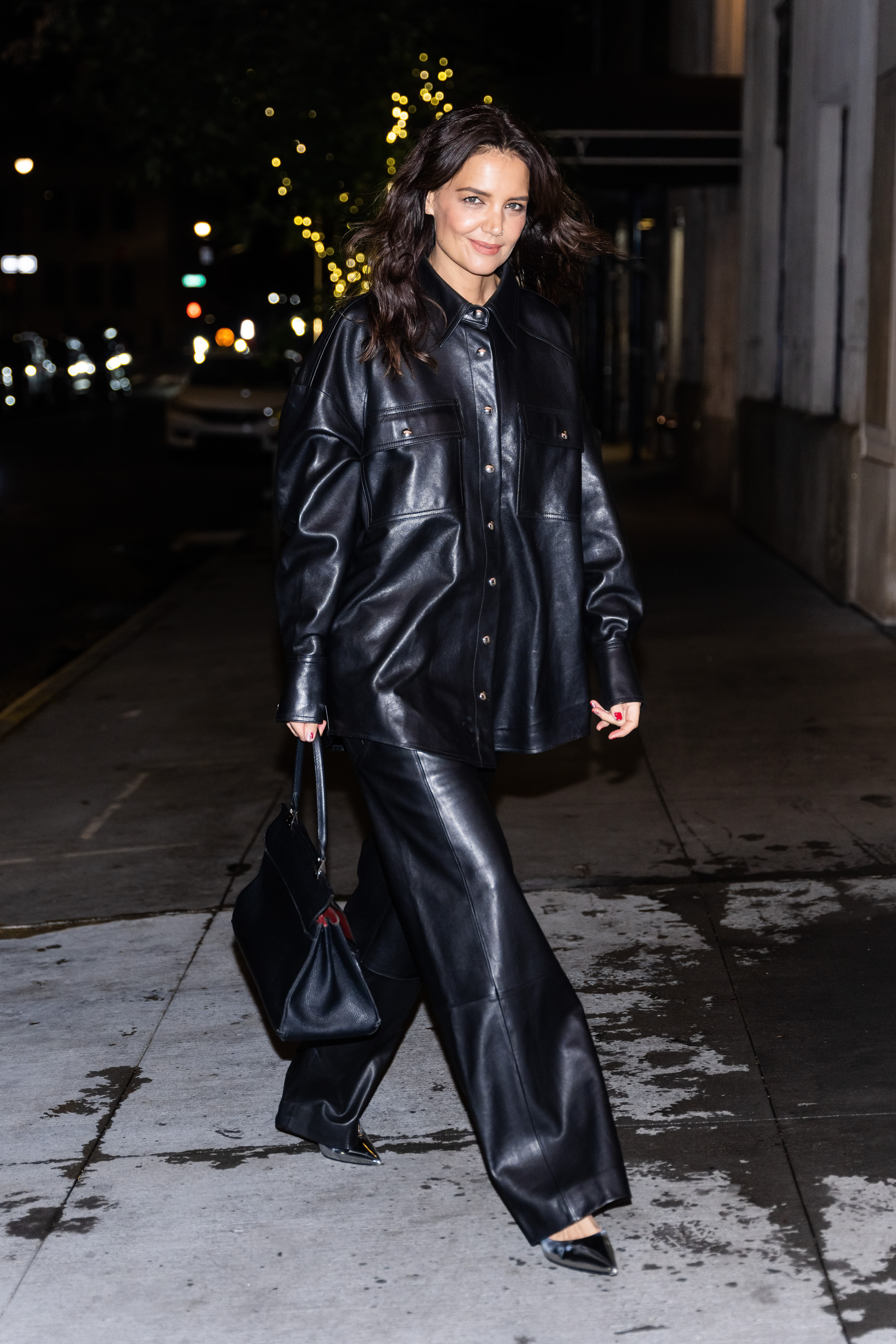 Who made Gigi Hadid's black boots, belt, handbag, round sunglasses, and  jewelry?
