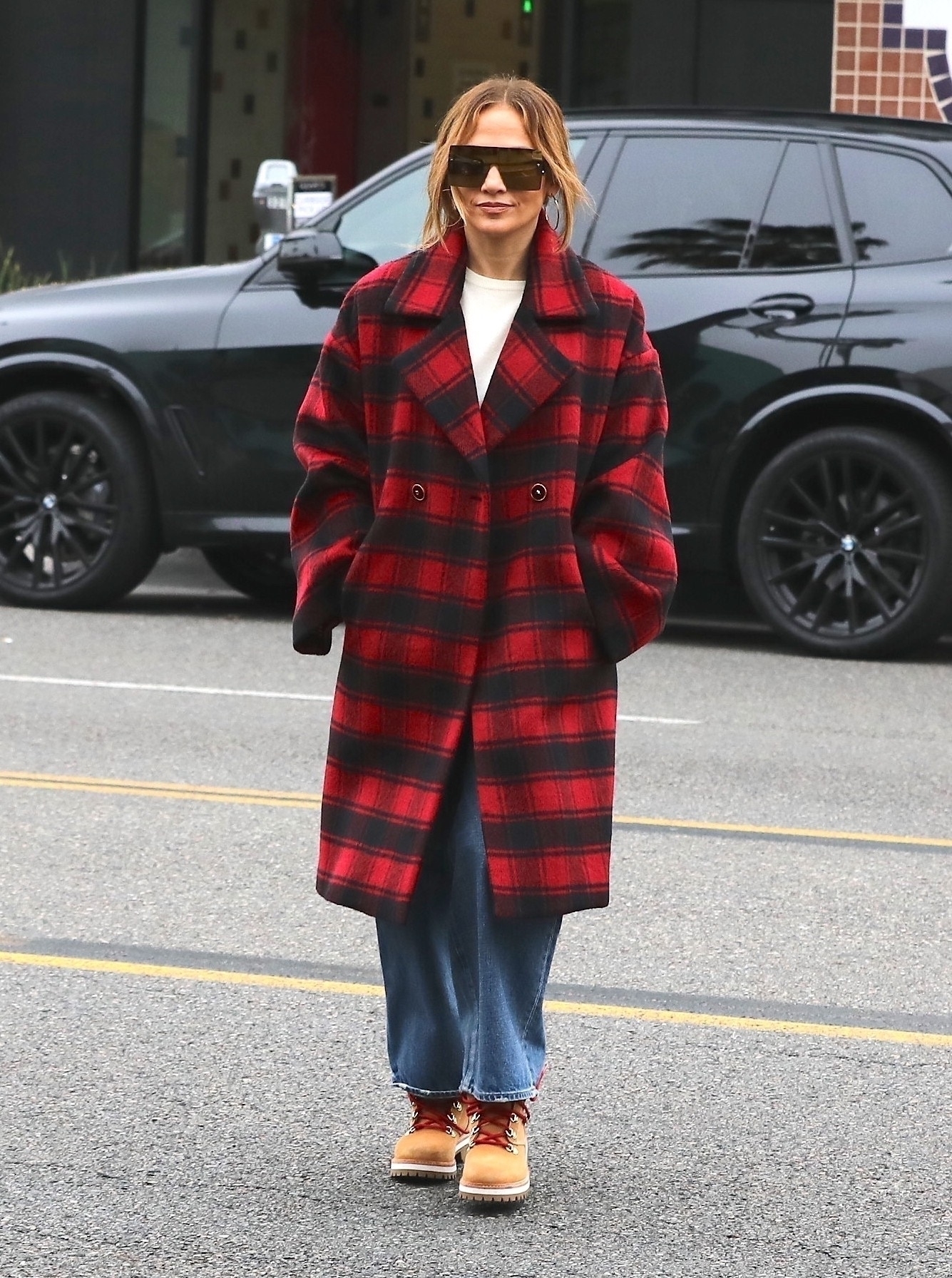 Selena Gomez Layered a Sleek Houndstooth Trench Coat Over a Louis
