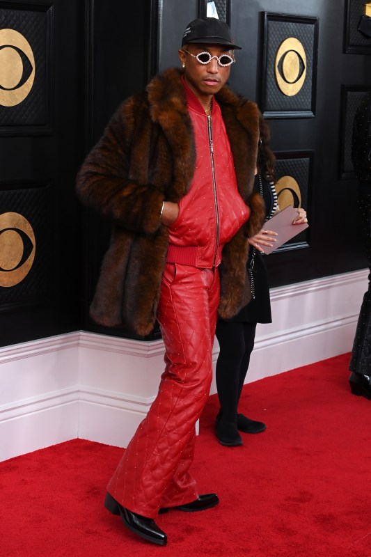 Lisa Hahnbueck wearing red Supreme x Louis Vuitton bag khaki hoody